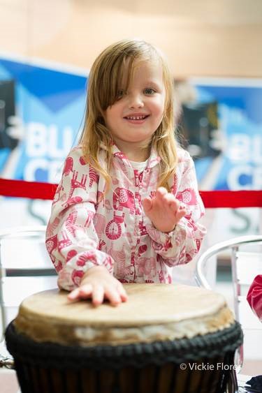Child playing drum at a shopping centre event