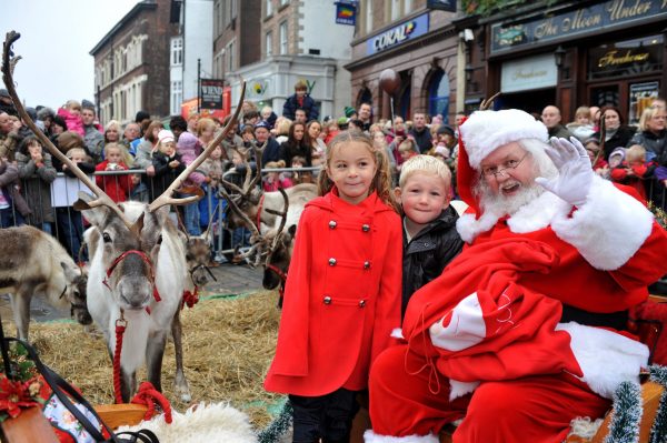 Father Christmas and reindeer at a Christmas parade