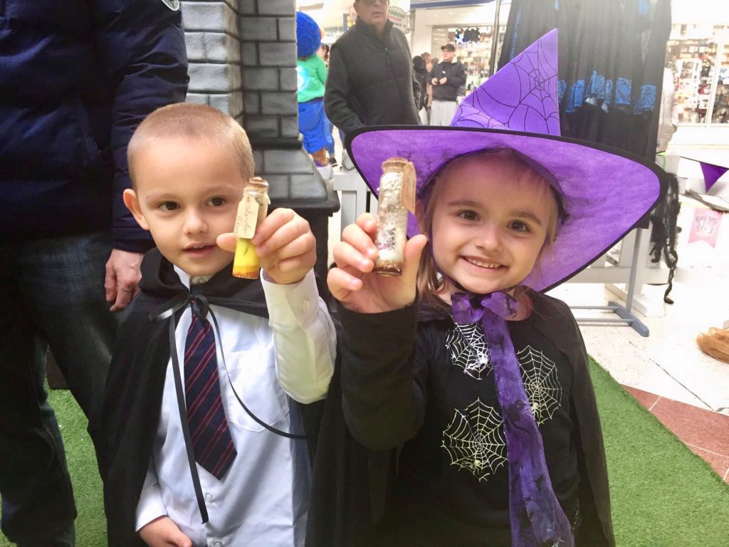 Two children dressed as witches