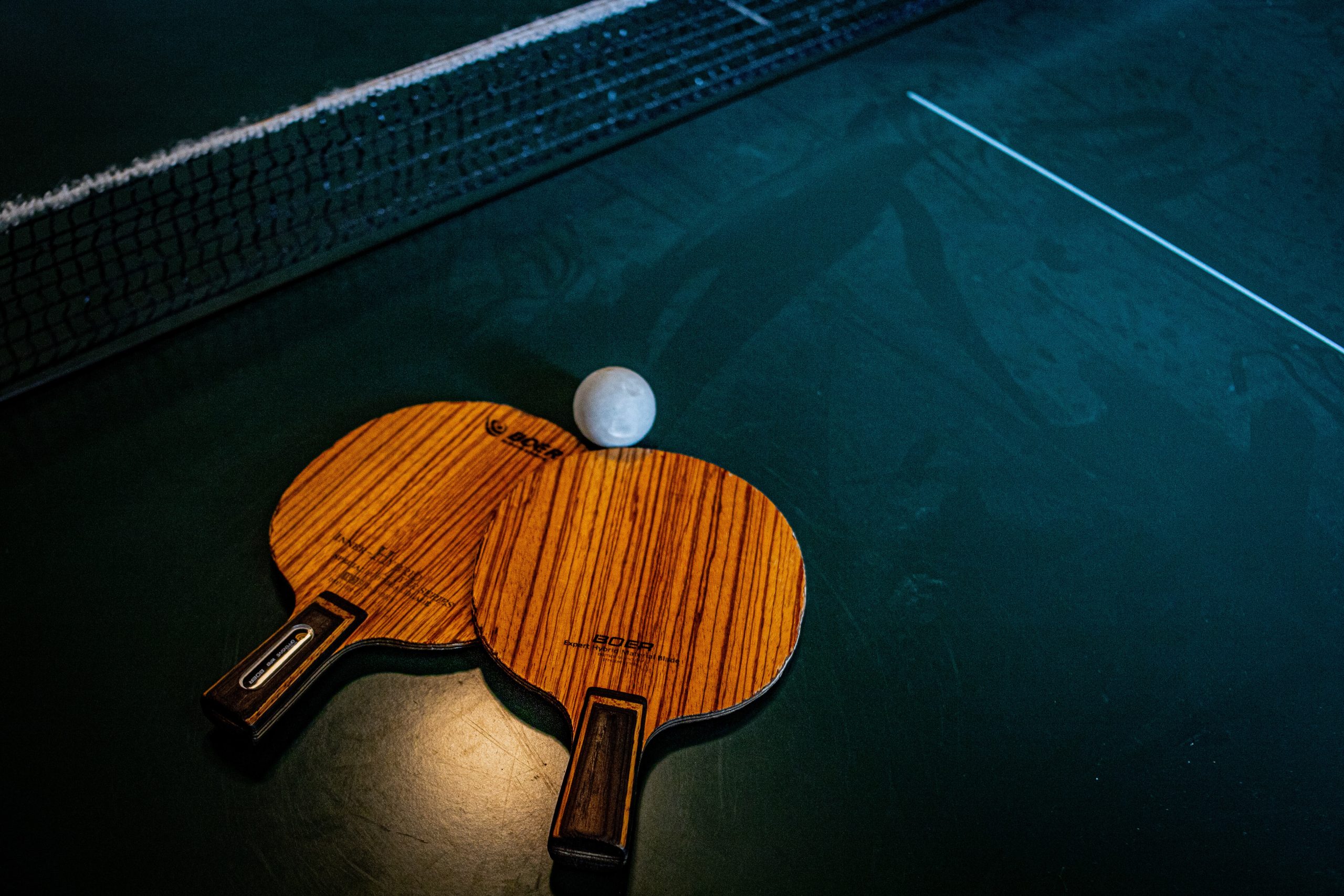 Ping pong rackets and ball on a table