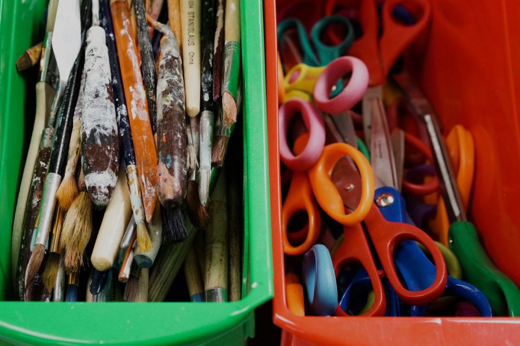 classroom art equipment in plastic boxes