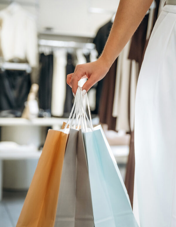 Shopper holding shopping bags